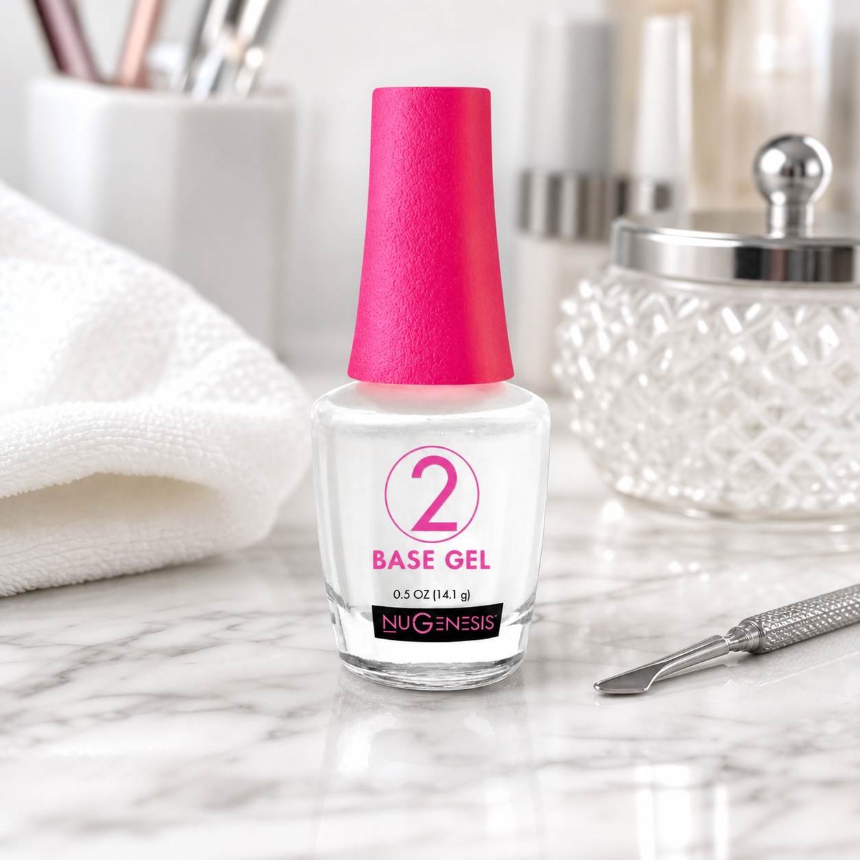 Nugenesis #2 Base Gel 0.5 oz bottle on a professional nail salon workstation